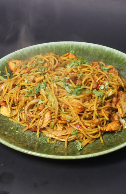 Delicious chicken and vegetable chow mein noodles on a plate
