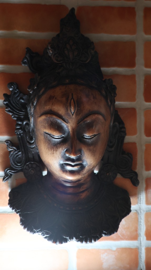 Traditional wood-carved deity mask