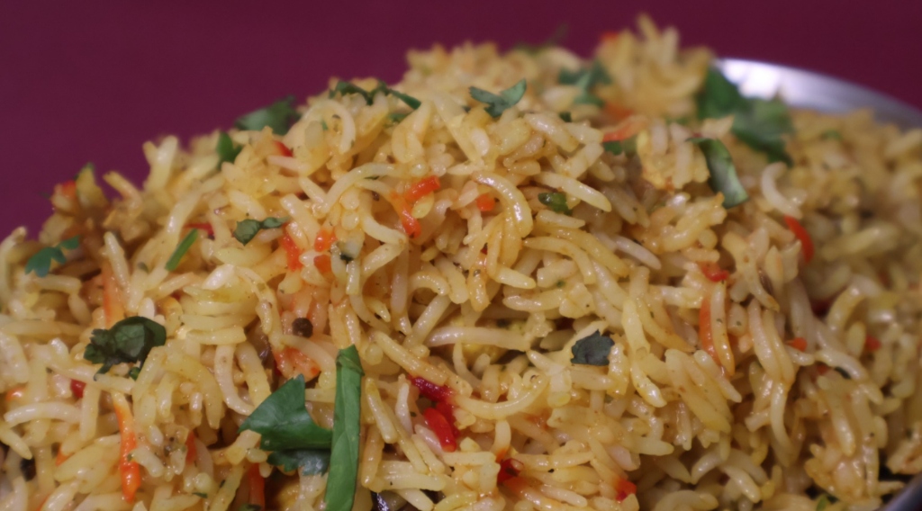 Fragrant basmati pulao rice garnished with fresh herbs